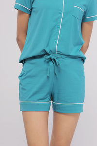 Teal shorts with white piping, comfortable and stylish for casual wear.