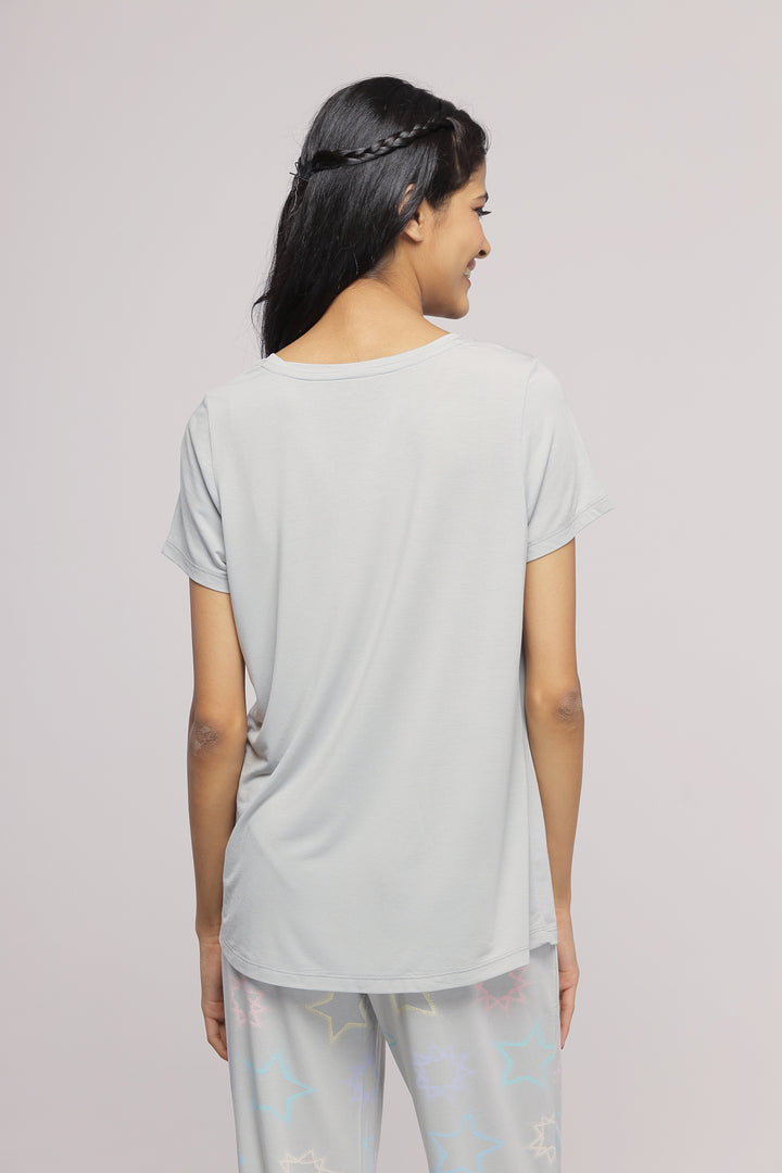 Woman in China Blue Supima® jogger set, back view.