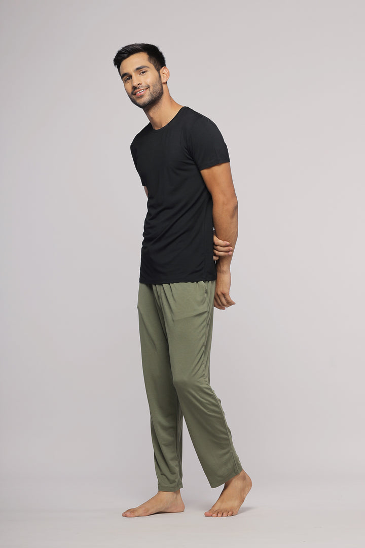 Black men's tee shirt worn with olive green pants.