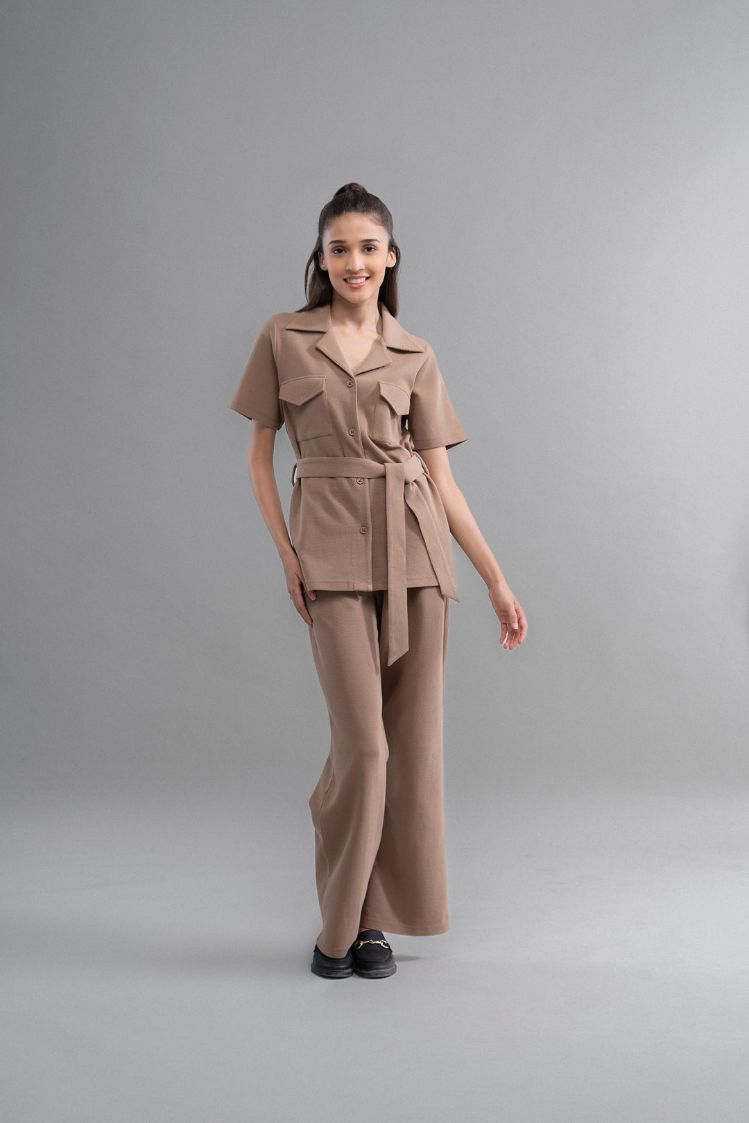 Model showcasing Lushknit® 2.0 Earthy Brown Multitask Pants outfit.