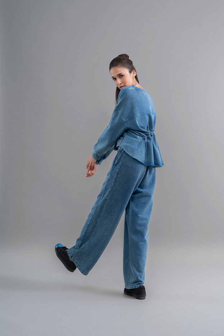 Denim wash cotton terry ruched sweatshirt styled outfit for women.