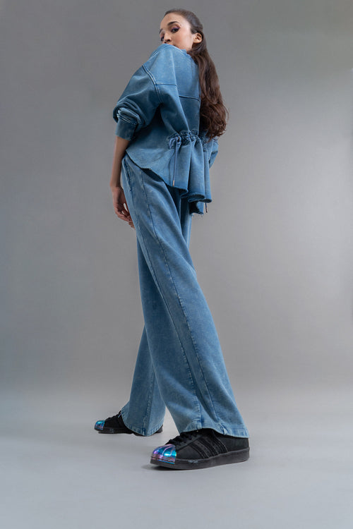Model showcases Denim Wash 100% Cotton Terry Straight Travel Pant.