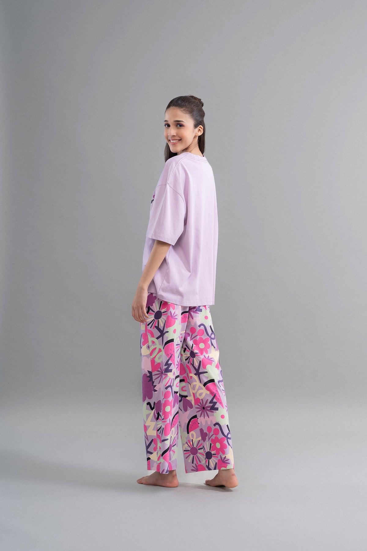 Enchanted purple cotton flared pajamas for stylish comfort and relaxation.
