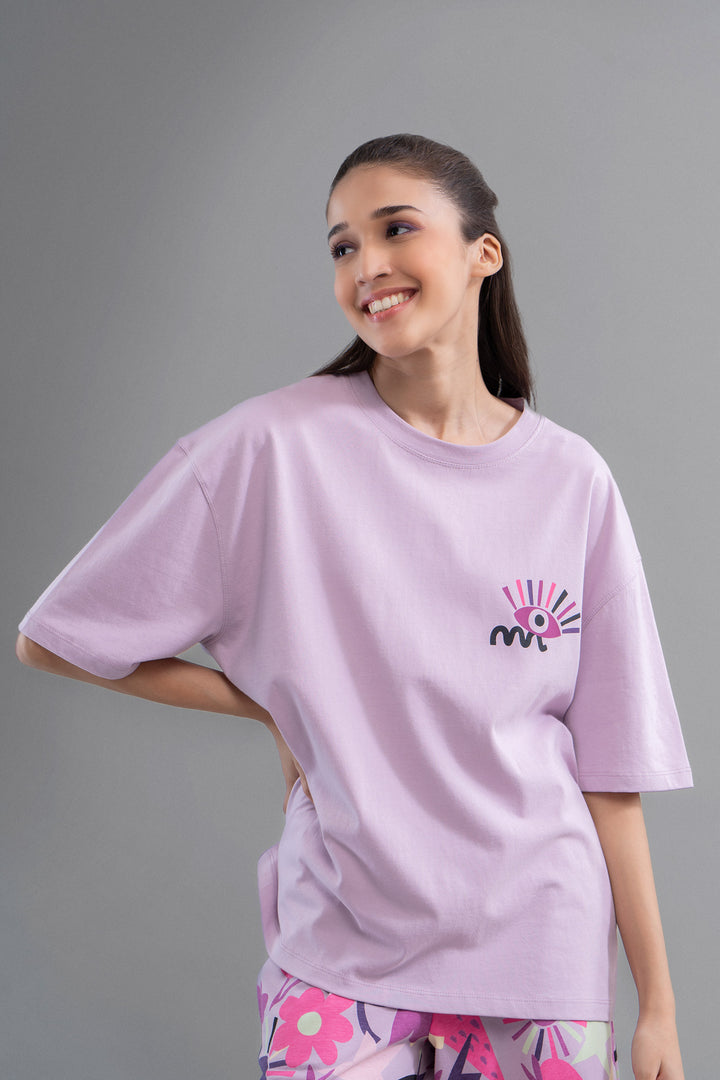 Smiling model wearing Enchanted Purple Cotton Pajama Set for women.