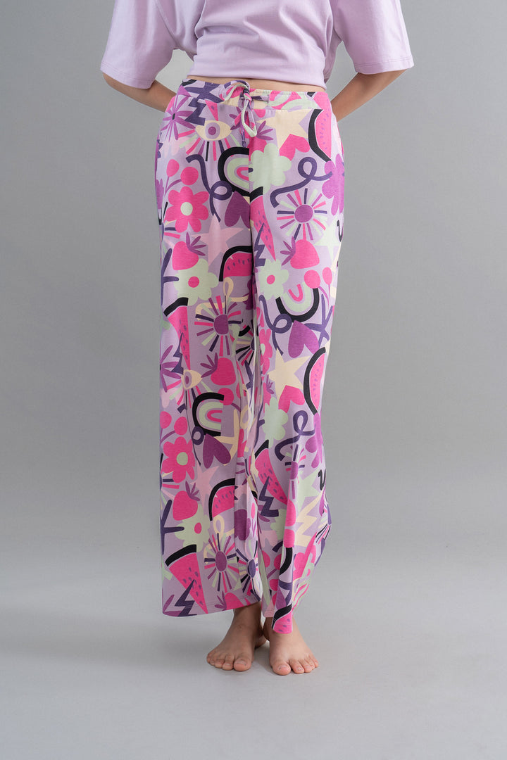 "Stylish Enchanted Purple Cotton Pajama Set with vibrant floral pattern."