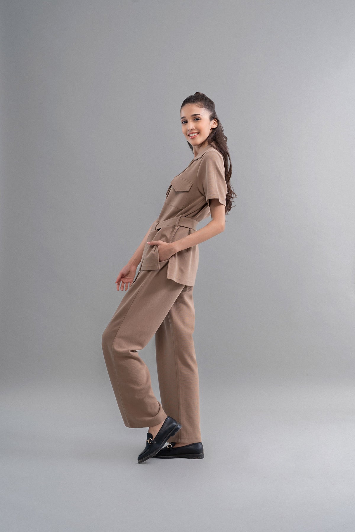 Woman modeling Safari Lushknit® 2.0 Earthy Brown Shirt and pants.