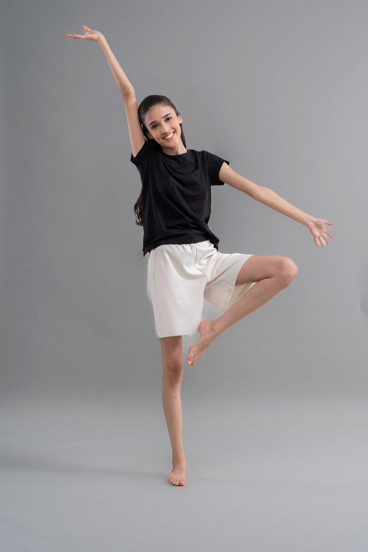 LushKnit Ivory Bermuda Set model posing in relaxed style.