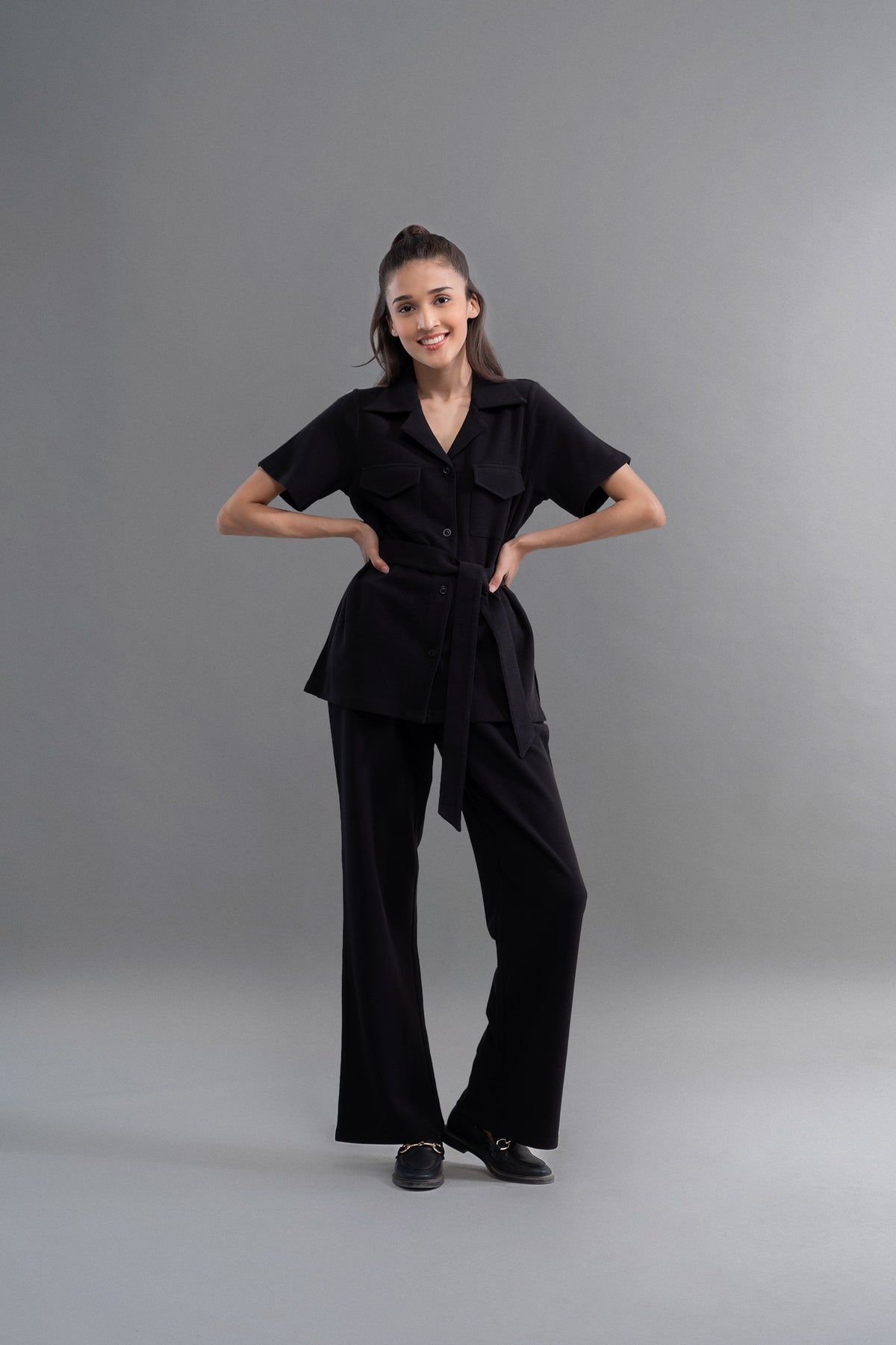 Model wearing Lushknit® 2.0 Black Straight Multitask Pants in studio.