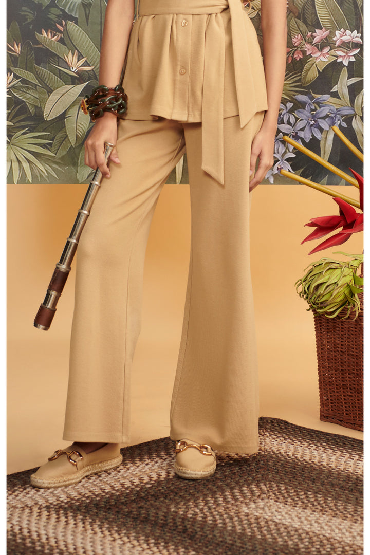 Mini waffle brown flared pants styled with a matching top and accessories.