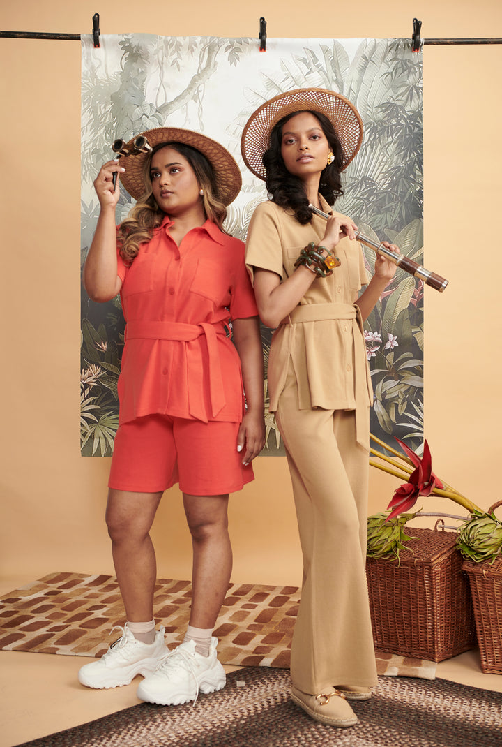 Model showcasing Mini Waffle Brown Flared Pants in stylish photoshoot setting.