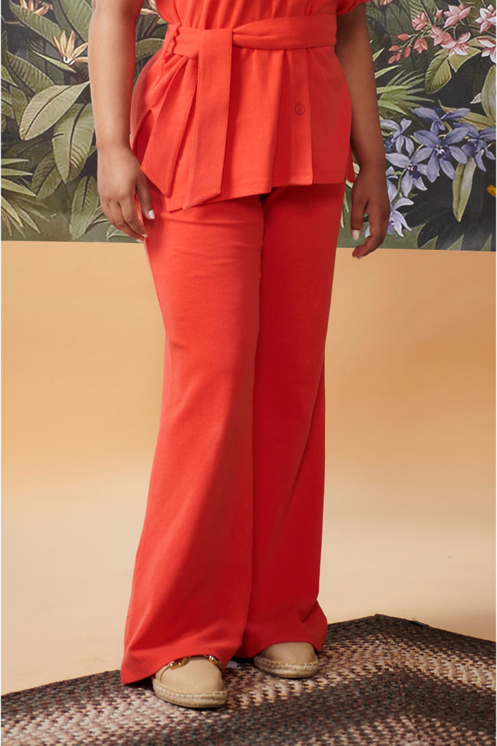 Mini Waffle Red Flared Pants styled with a trendy belted top.