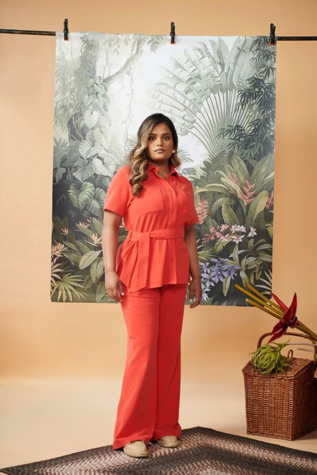Mini Waffle Red Flared Pants styled with a matching top in vibrant setting.