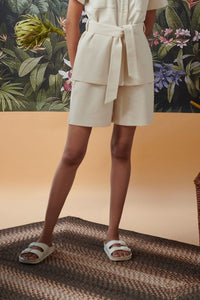 Mini Waffle Ivory Bermuda shorts styled with a belted top.
