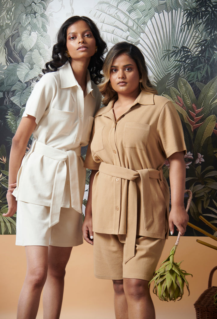 Mini Waffle Brown Safari Bermuda Set worn by models against tropical backdrop.