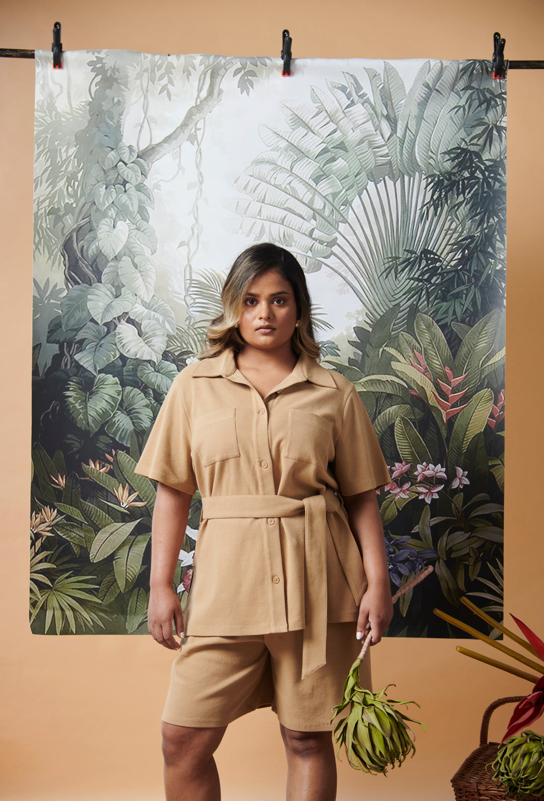 Mini Waffle Brown Safari Bermuda Set modeled against a lush tropical backdrop.