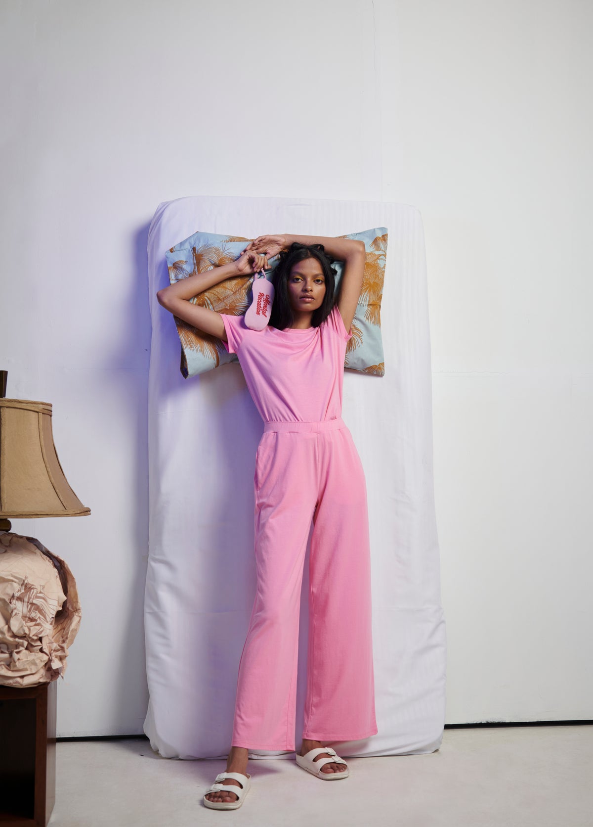 Model in pink Supima® flared pants styled with casual look.