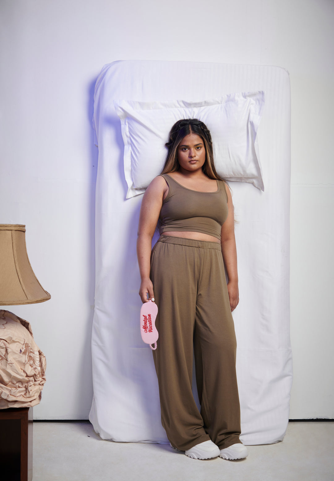 Olive Supima® flared pants styled with a cozy tank top.