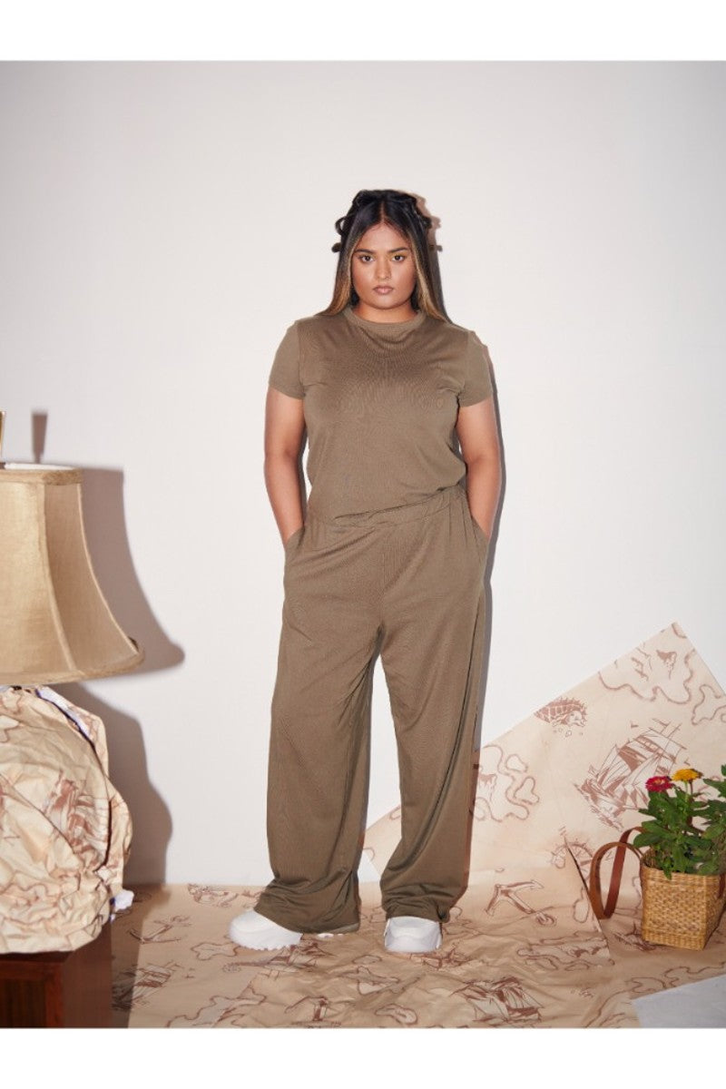 "Model wearing Olive Supima® Co-ord Set in stylish indoor setting."