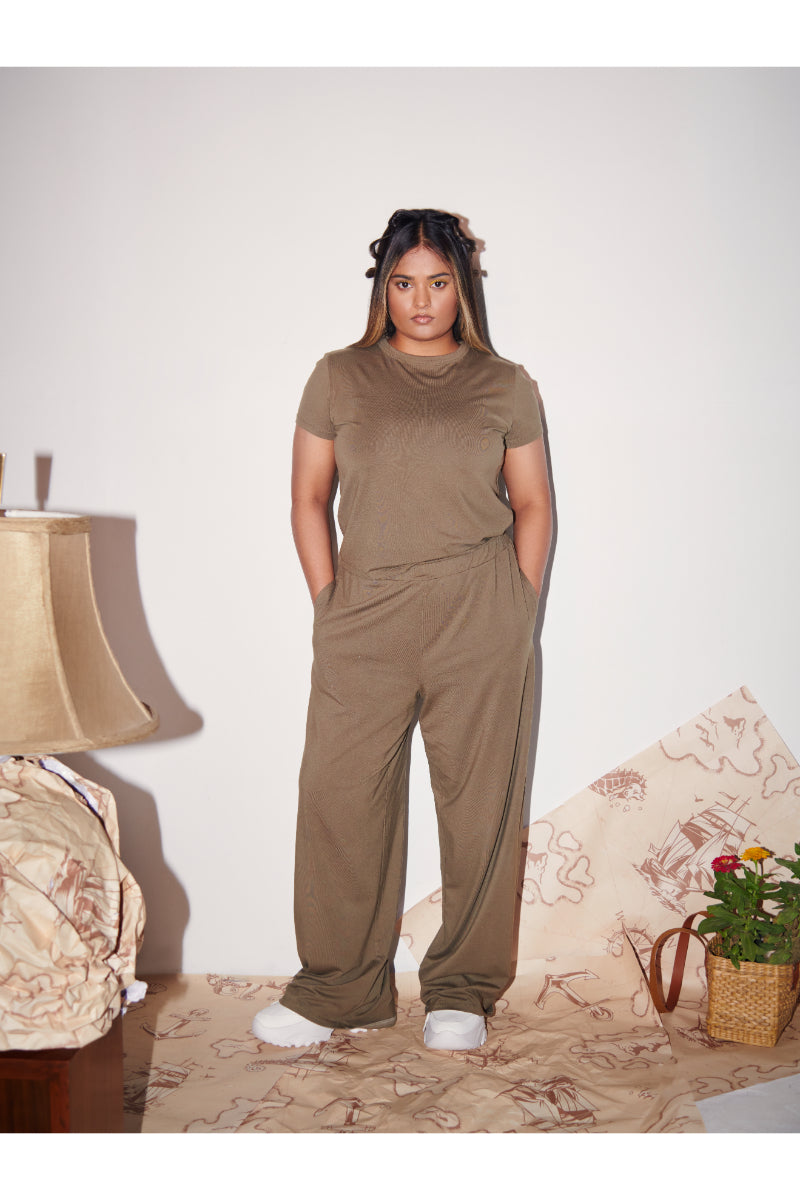 Olive Supima® flared pants styled with matching top, casual chic look.