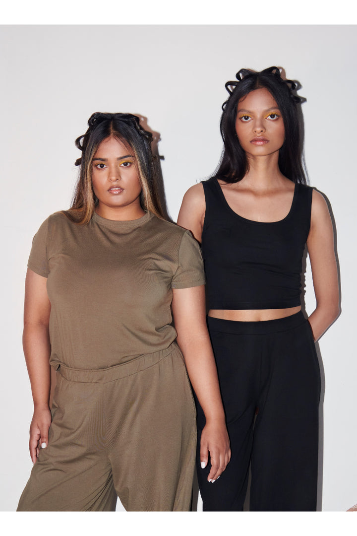 Olive Supima® T-Shirt displayed on diverse models in stylish outfits.