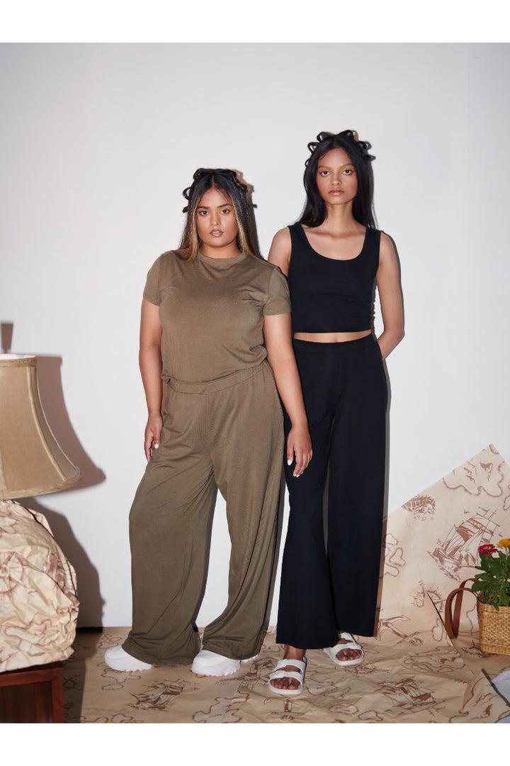 Olive Supima® flared pants styled with matching tops on models.