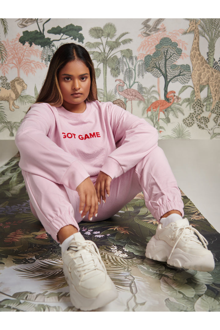 Pink bamboo terry jogger set styled with white sneakers.