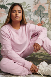 Bamboo Terry Pink Travel Jogger Set styled model on decorative background.