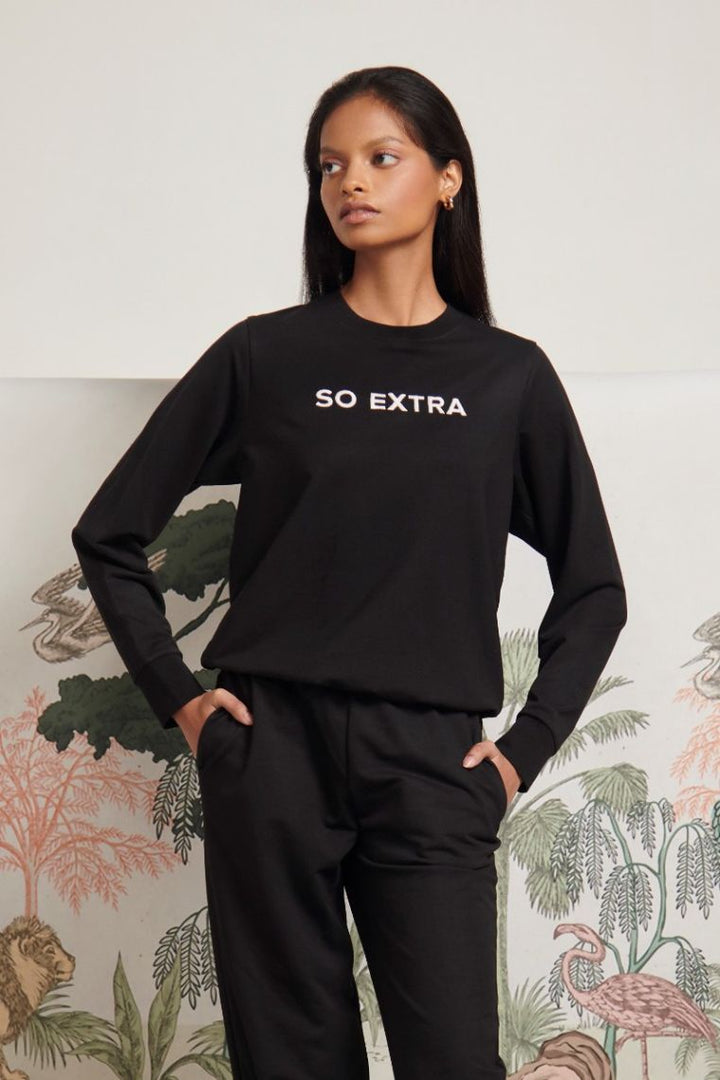 So Extra Bamboo Terry Jogger Set model wearing stylish black outfit.