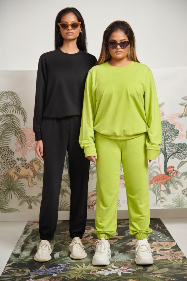Bamboo Terry Green Travel Joggers worn by two models.