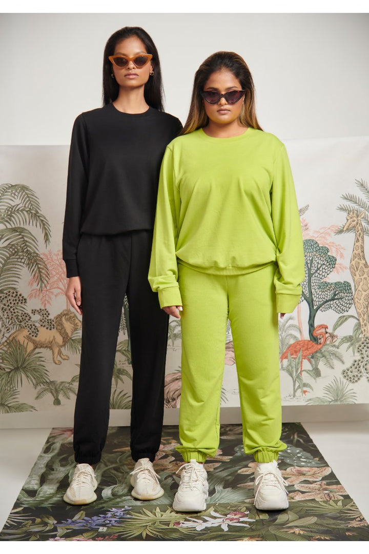 Bamboo terry black travel jogger set modeled by two women.