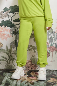 Bamboo Terry Green Travel Joggers with stylish white sneakers.