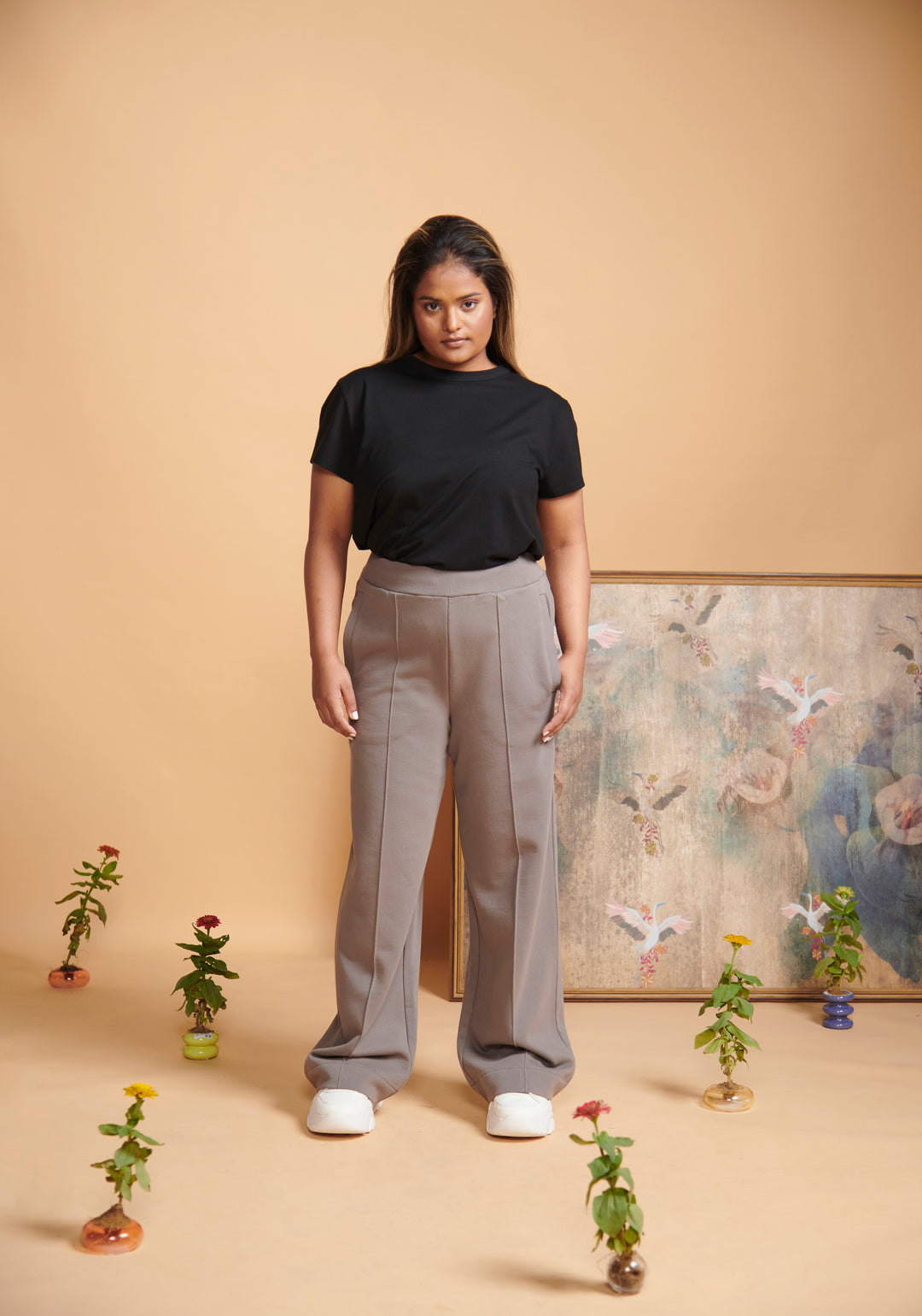 Grey Terry High Waist Travel Pant styled with black top and white shoes.