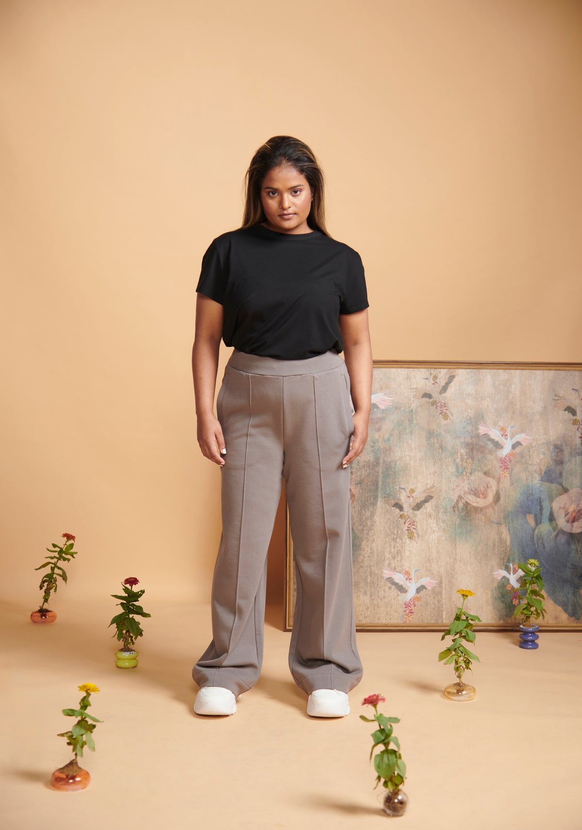 Grey Terry High Waist Travel Pant styled with black top and white shoes.