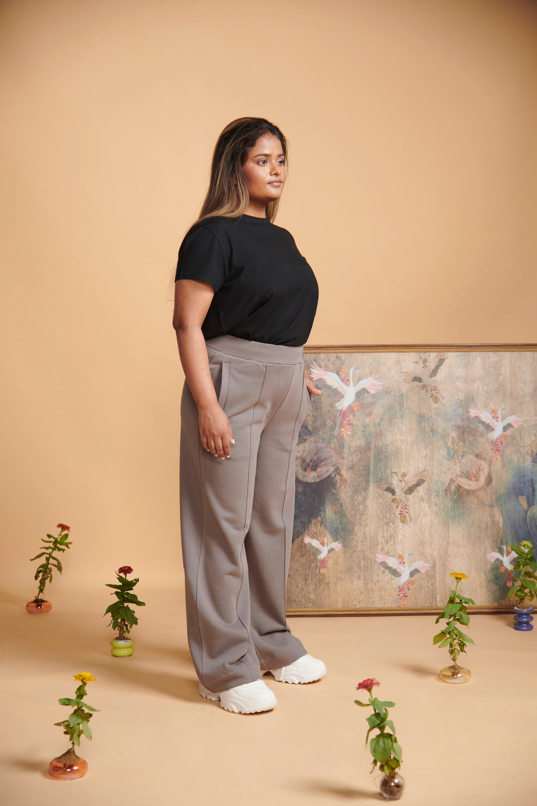 Grey terry high waist travel pant modeled on a woman.