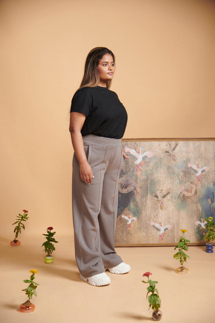 Grey terry high waist travel pant modeled on a woman.
