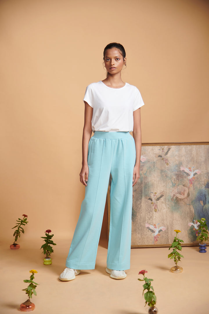 Blue Terry High Waist Travel Pant styled with a white top.