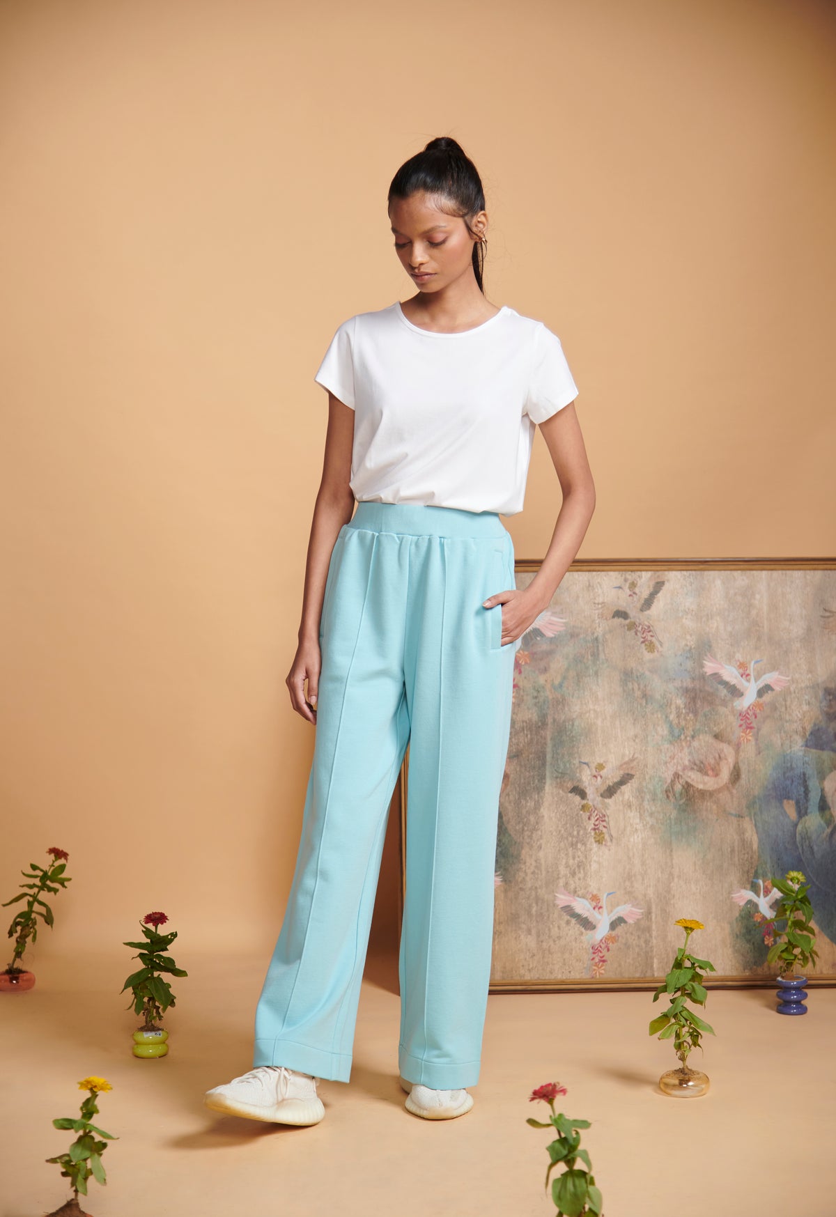 Blue Terry High Waist Travel Pant worn with a white t-shirt.