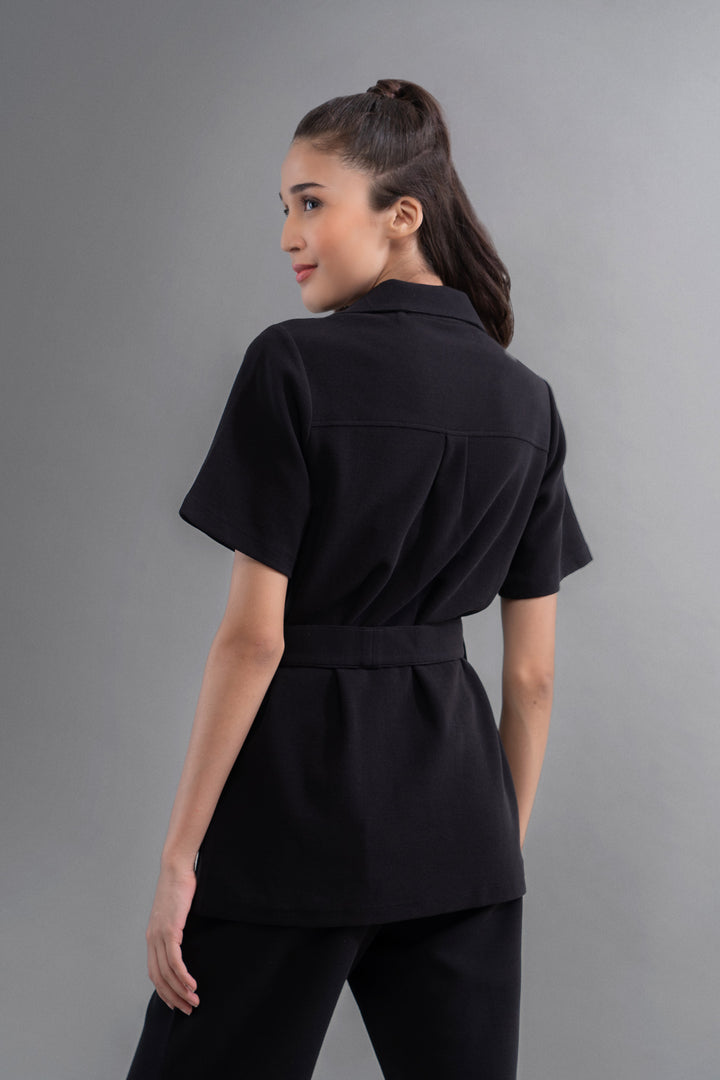 Woman wearing Safari Lushknit® 2.0 Black Shirt from the back.