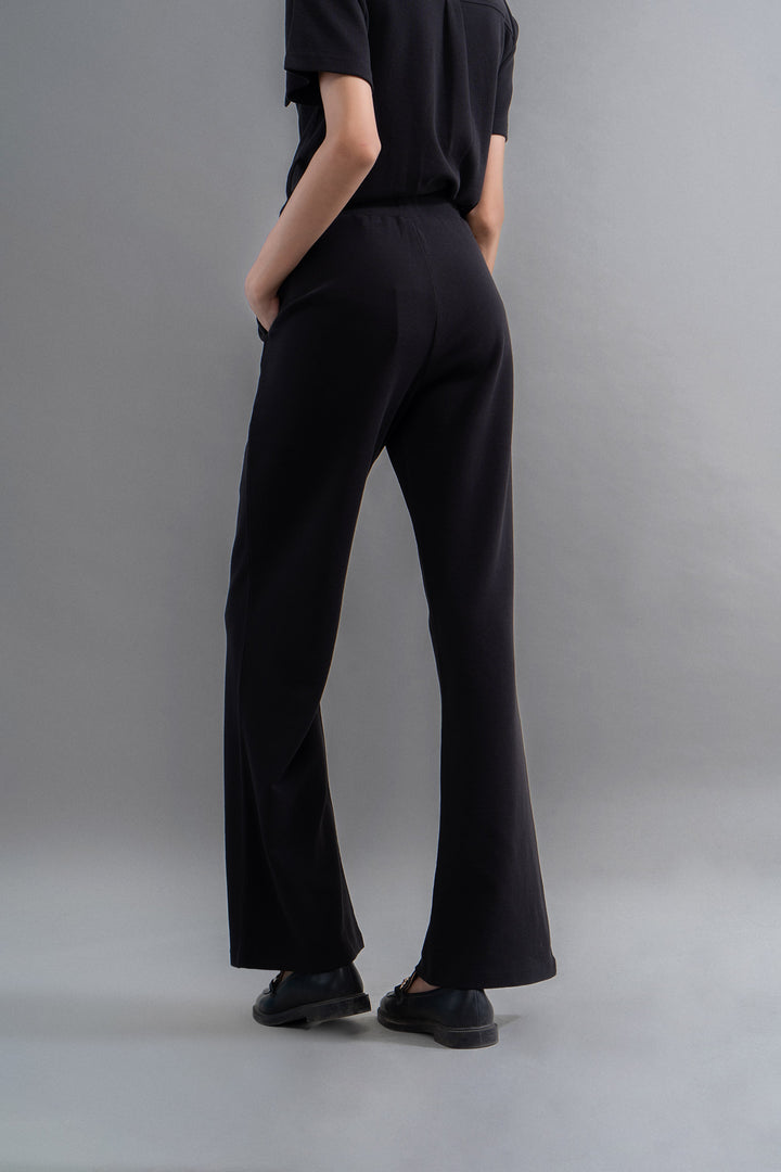 Lushknit® 2.0 black straight multitask pants worn from the back.