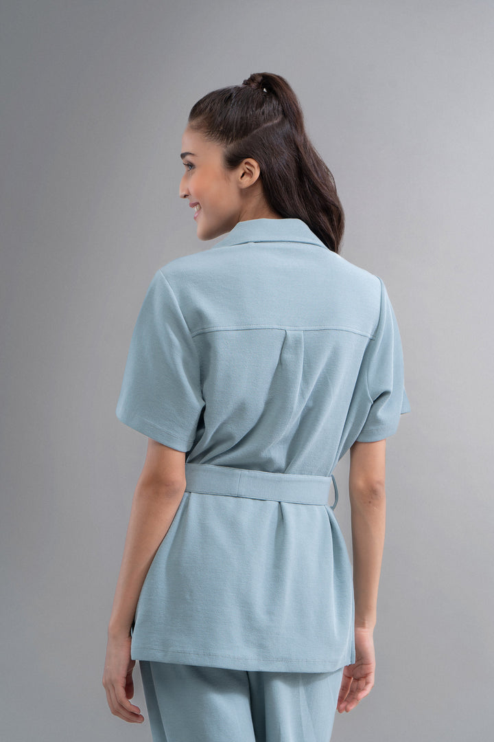 Woman wearing Safari Lushknit® 2.0 Aqua Shirt, stylish back view.