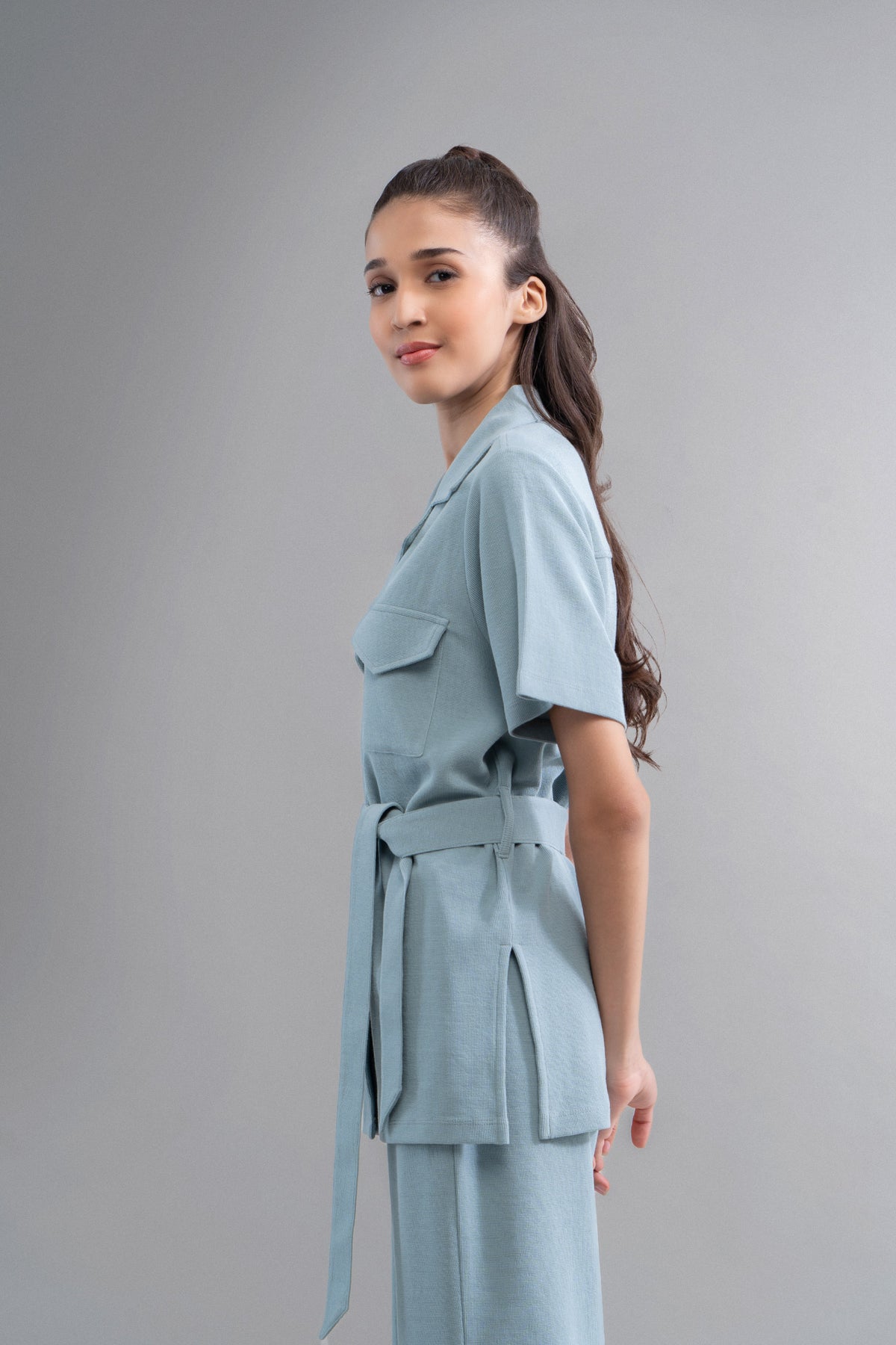Model wearing Safari Lushknit® 2.0 Aqua Shirt, stylish and trendy.