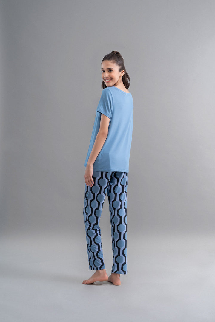 Model wearing Q Heart Modal Round Neck Top with patterned pants.