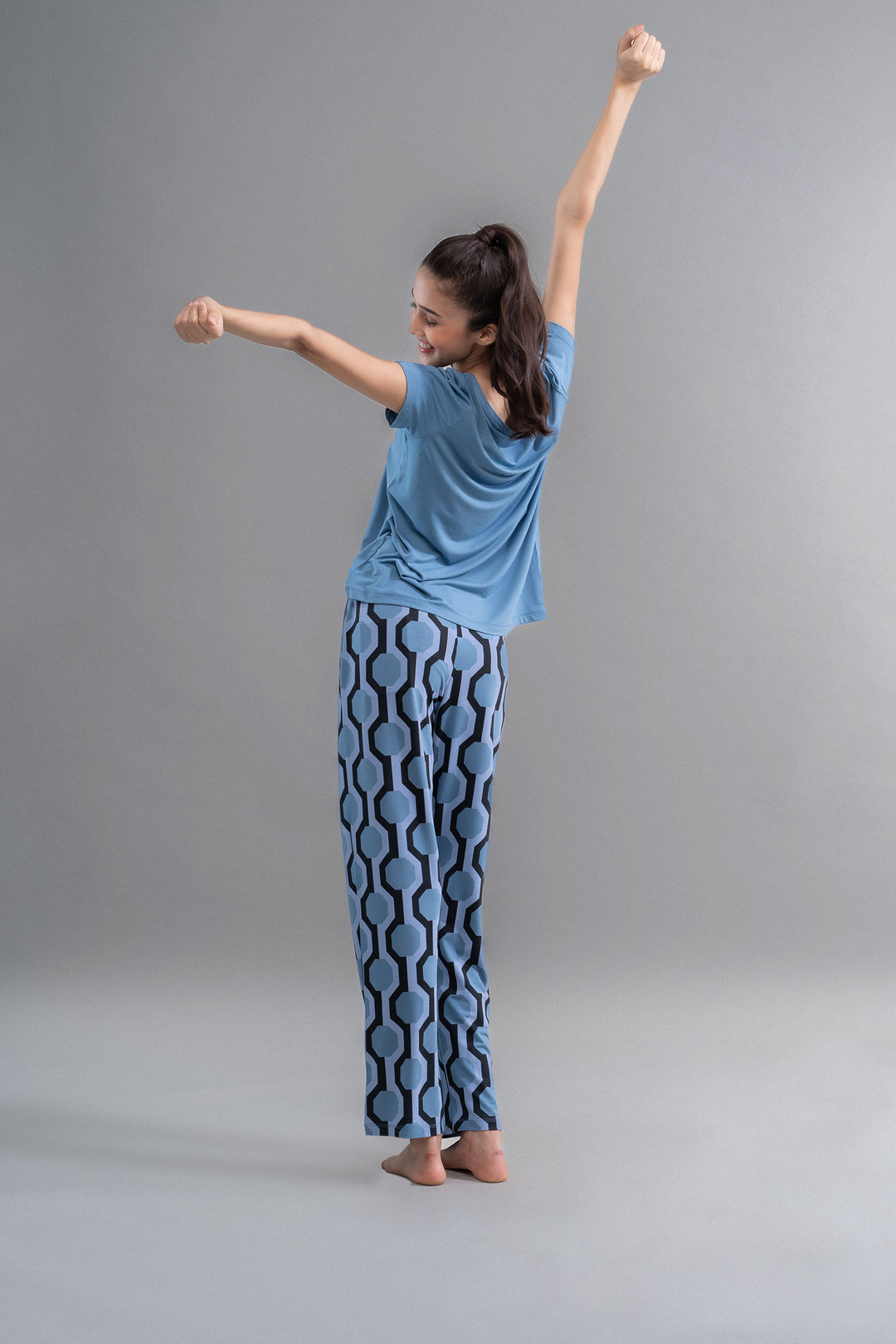 Model wearing Q Heart Modal Round Neck Top with patterned pants.