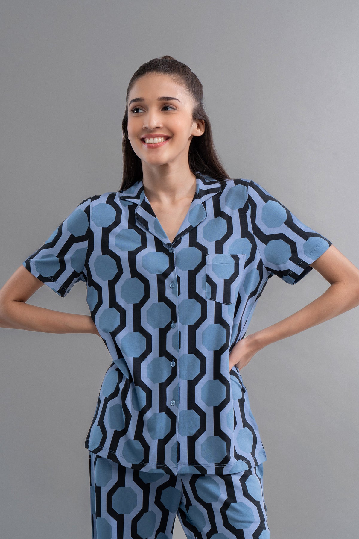 Midnight blue geometric modal button down half sleeve shirt on model.