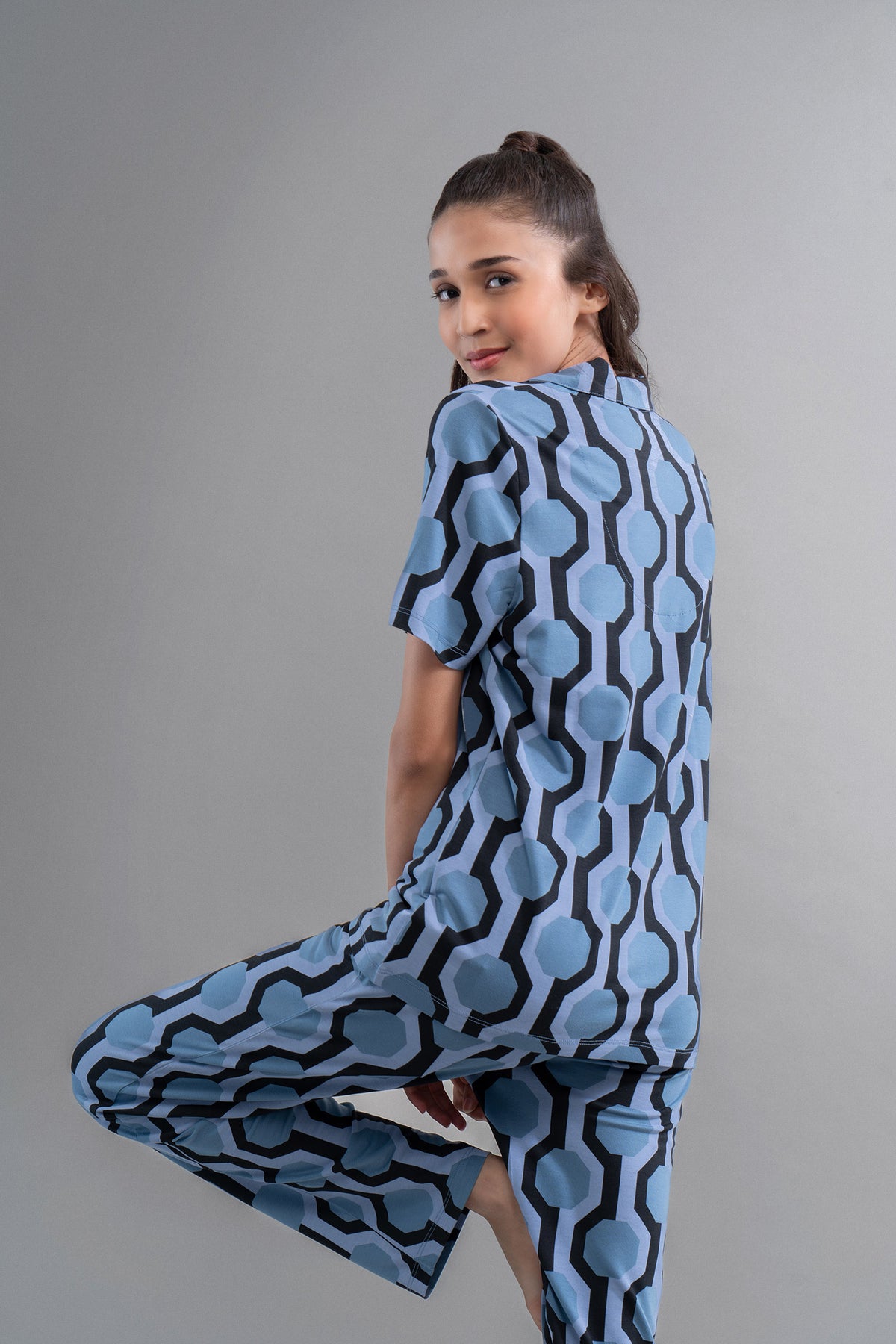 Midnight blue geometric modal button down shirt model, half sleeve style.