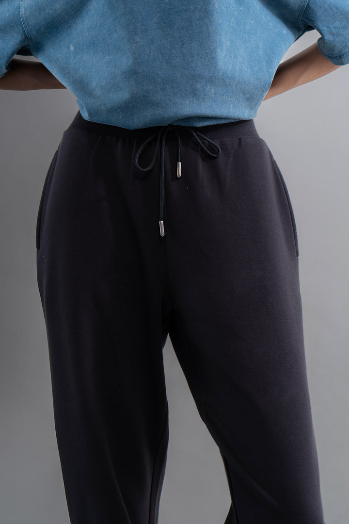 Snugknit® black joggers with adjustable drawstring waist and side pockets.