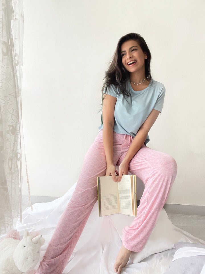 Blush Pattern Lounge Set featuring a smiling woman reading a book.