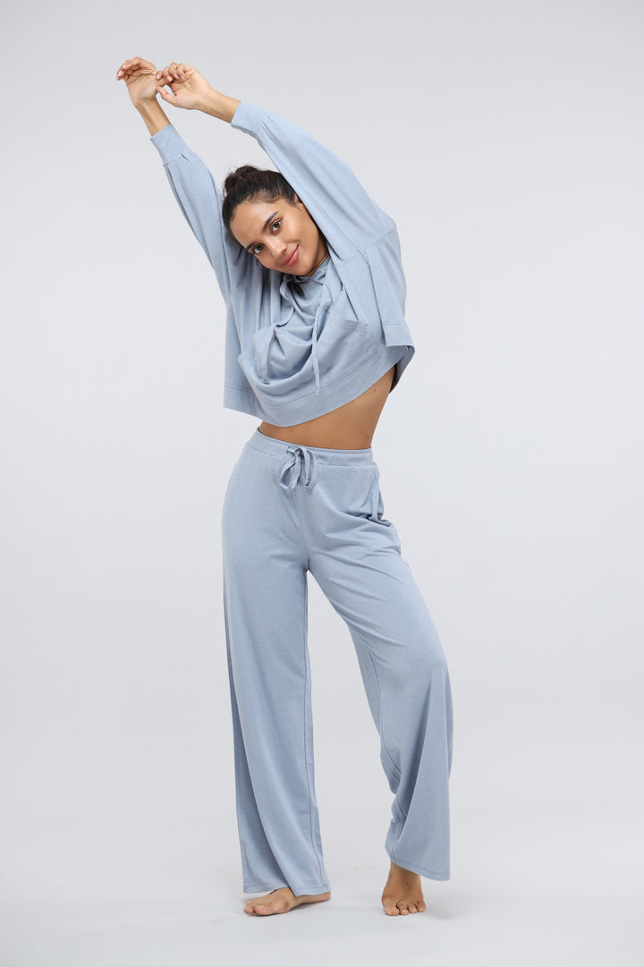 Limited Edition Luxflo Hoodie Set in soft blue, model posing elegantly.