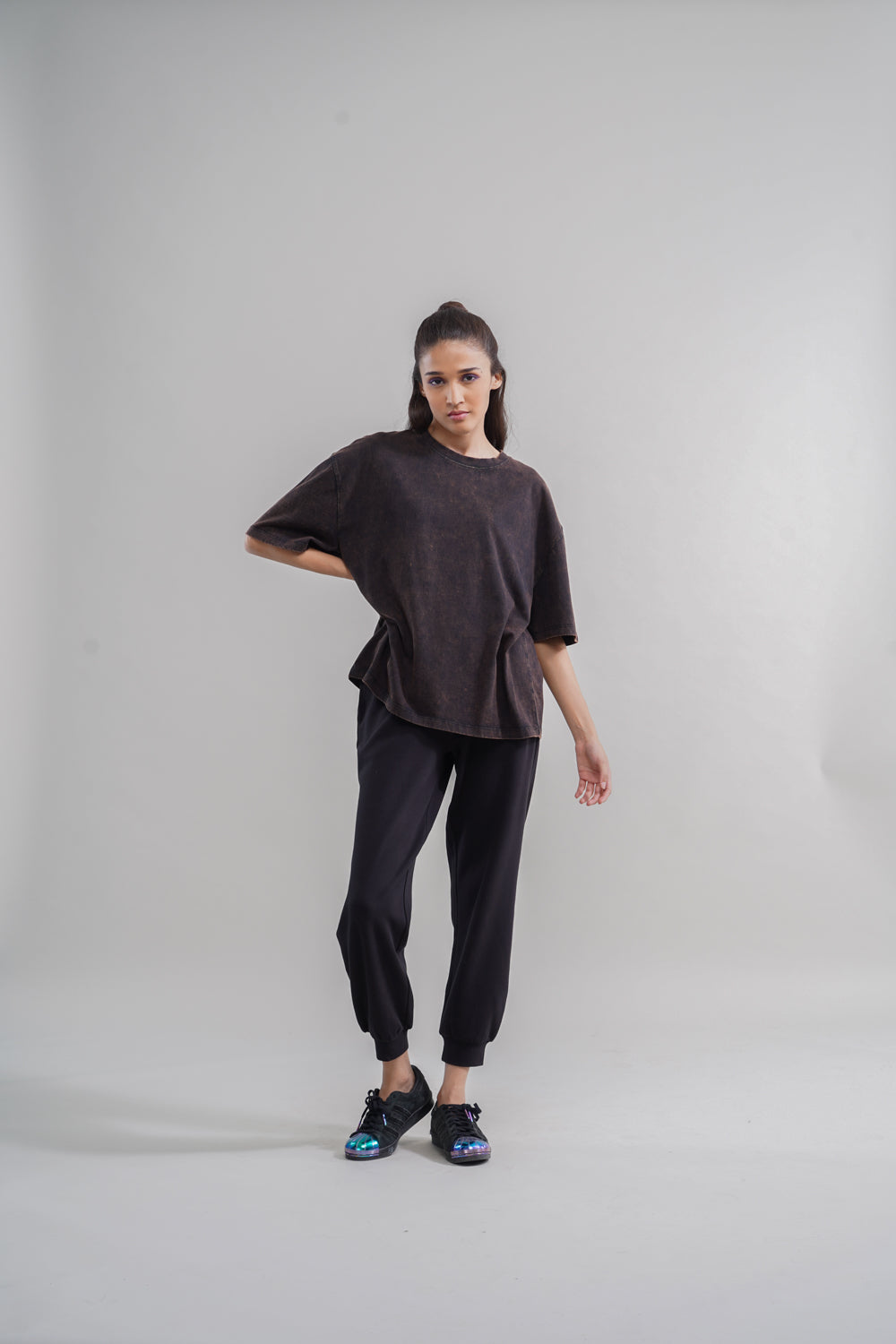 Acid wash unisex t-shirt styled with casual black pants.