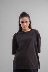 Acid wash unisex t-shirt displayed on a model in studio setting.